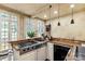 Rustic kitchen with butcher block counters, stainless gas cooktop and bright, windowed walls at 7 Kings Mountain St, York, SC 29745