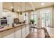Well-lit kitchen featuring butcher block counters, island, and multiple windows at 7 Kings Mountain St, York, SC 29745