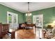 Well-lit room with a piano and seating, offering a comfortable and inviting space at 7 Kings Mountain St, York, SC 29745