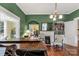 View of a cozy living room with hardwood floors, fireplace, and built-in bookshelves at 7 Kings Mountain St, York, SC 29745