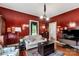 Comfortable living space with vintage accents, hardwood floors, and natural light from the window at 7 Kings Mountain St, York, SC 29745
