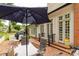 The brick patio features outdoor dining, a relaxing space to enjoy the backyard and adjacent doors to the home at 7 Kings Mountain St, York, SC 29745