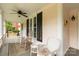 Charming front porch with rocking chairs and a ceiling fan provides a relaxing outdoor space at 7 Kings Mountain St, York, SC 29745