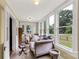 Bright sunroom featuring a daybed, multiple windows, and views of the surrounding greenery at 7 Kings Mountain St, York, SC 29745