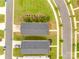 Aerial view of symmetrical homes, showcasing backyard landscapes, driveways, and community layout at 700 Windage Way, Pineville, NC 28134