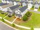 An aerial view captures the home's landscaped yard, neighborhood streets, and surrounding residences at 700 Windage Way, Pineville, NC 28134