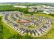A beautiful aerial view showcases a vibrant community with lush landscaping and modern homes at 700 Windage Way, Pineville, NC 28134