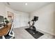Bright bedroom with a bike and desk offers a quiet workspace with natural light creates an ideal work-from-home environment at 700 Windage Way, Pineville, NC 28134