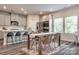 Eat-in kitchen with stylish dining set and ample seating, ideal for Gathering meals at 700 Windage Way, Pineville, NC 28134