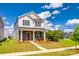Charming two-story home with stone accents, covered porch, manicured lawn, and inviting curb appeal at 700 Windage Way, Pineville, NC 28134