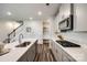 Modern kitchen features stainless steel appliances, white countertops, and ample cabinet space, perfect for culinary enthusiasts at 700 Windage Way, Pineville, NC 28134