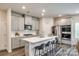 Modern kitchen boasting stainless steel appliances, a large island, and sleek gray cabinetry at 700 Windage Way, Pineville, NC 28134