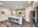 Bright kitchen featuring quartz countertops, stainless steel appliances, and a center island at 700 Windage Way, Pineville, NC 28134