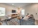 Comfortable living room with ample natural light, stylish furniture, and hardwood flooring at 700 Windage Way, Pineville, NC 28134