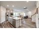 Open-concept kitchen and living area with stainless steel appliances and plenty of space for dining and entertainment at 700 Windage Way, Pineville, NC 28134
