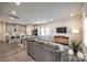 Open-concept living space with kitchen, dining, and lounging areas, perfect for entertaining at 700 Windage Way, Pineville, NC 28134