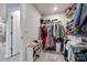 Spacious walk-in closet with ample storage, shelving, and racks for organized wardrobe display at 700 Windage Way, Pineville, NC 28134