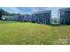 Expansive backyard featuring lush green lawn and privacy fence perfect for outdoor enjoyment at 7024 Wheyfield Dr, Charlotte, NC 28215