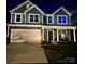 Inviting two-story home with a covered front porch and a spacious two car garage at 7024 Wheyfield Dr, Charlotte, NC 28215