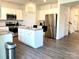 Modern kitchen with stainless steel appliances, granite countertops, and a center island with bar seating at 7024 Wheyfield Dr, Charlotte, NC 28215