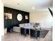 Comfortable living room with stylish accent wall, modern decor and ample seating at 7024 Wheyfield Dr, Charlotte, NC 28215