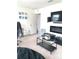 Living room boasting carpeted floors, a tv with modern fireplace and neutral walls at 7024 Wheyfield Dr, Charlotte, NC 28215