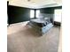 Spacious main bedroom features a plush bed, tray ceiling, and dark accent wall at 7024 Wheyfield Dr, Charlotte, NC 28215