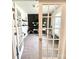 This office has french doors, neutral carpet and paint, and modern furnishings at 7024 Wheyfield Dr, Charlotte, NC 28215