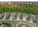 Aerial view of a neighborhood showcasing well-manicured lawns, mature trees, and a desirable residential location at 7331 Millstone Sw Cir, Concord, NC 28025