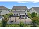 Aerial view of backyard featuring a stone patio and outdoor lounge area at 7331 Millstone Sw Cir, Concord, NC 28025