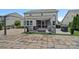 Well-equipped backyard patio with a fire pit and lounge chairs at 7331 Millstone Sw Cir, Concord, NC 28025