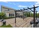 Backyard featuring an expansive patio area with an outdoor kitchen at 7331 Millstone Sw Cir, Concord, NC 28025