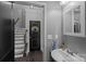 Cozy half bathroom featuring a modern sink, stylish mirror, and gray walls at 7331 Millstone Sw Cir, Concord, NC 28025