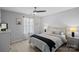 Bedroom featuring a ceiling fan, a large window, and neutral decor at 7331 Millstone Sw Cir, Concord, NC 28025