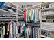 Walk-in closet with shelves and hanging rods, perfect for storing clothing and accessories at 7331 Millstone Sw Cir, Concord, NC 28025