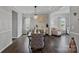 Well-lit dining room featuring modern decor and hardwood floors at 7331 Millstone Sw Cir, Concord, NC 28025