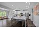 Open-concept kitchen with stainless steel appliances, large island, and modern finishes at 7331 Millstone Sw Cir, Concord, NC 28025