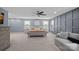 Spacious main bedroom with soft carpet, paneled accent wall, and ample natural light at 7331 Millstone Sw Cir, Concord, NC 28025