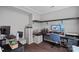 Functional home office with multiple work stations, wood floors, and storage at 7331 Millstone Sw Cir, Concord, NC 28025
