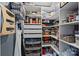Organized pantry with shelving, drawers, wire baskets, and various food storage containers at 7331 Millstone Sw Cir, Concord, NC 28025