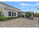 A spacious stone patio with outdoor lighting, seating area, and partial shade, ideal for relaxation and gatherings at 7331 Millstone Sw Cir, Concord, NC 28025