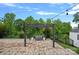 Pergola with string lights, seating area, and lush green surroundings at 7331 Millstone Sw Cir, Concord, NC 28025