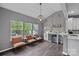 Bright sitting area with wine storage, marble counters, modern lighting and large windows at 7331 Millstone Sw Cir, Concord, NC 28025