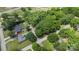An aerial view of a house nestled in a wooded area, highlighting the lush, green surroundings at 800 Davenport St, Monroe, NC 28112