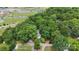 Aerial view highlighting a home nestled among mature trees, close to schools and athletic fields at 800 Davenport St, Monroe, NC 28112