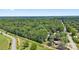 Wide aerial shot shows residential area surrounded by mature trees, with houses and roads visible at 800 Davenport St, Monroe, NC 28112