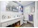 Bright bathroom with a large mirror, double sink vanity, and updated fixtures at 800 Davenport St, Monroe, NC 28112