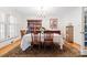 Formal dining room with hardwood floors, classic furniture, and elegant chandelier at 800 Davenport St, Monroe, NC 28112