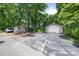 Long driveway leading to detached garage and parking area at 800 Davenport St, Monroe, NC 28112