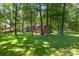 Charming brick home with trees providing privacy and ample shade to the home at 800 Davenport St, Monroe, NC 28112